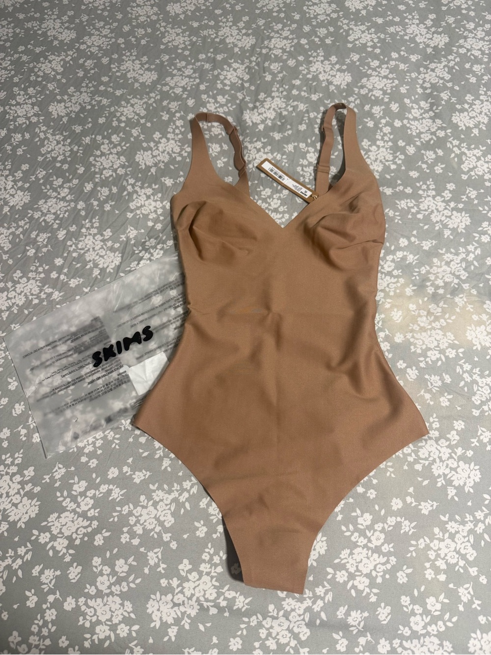 SKIMS Tan Kids One-Piece Bodysuit